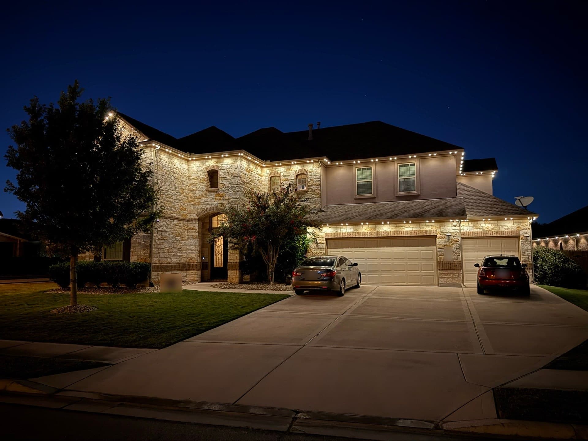 Permanent roofline lighting extending outdoor living on an Austin patio at night