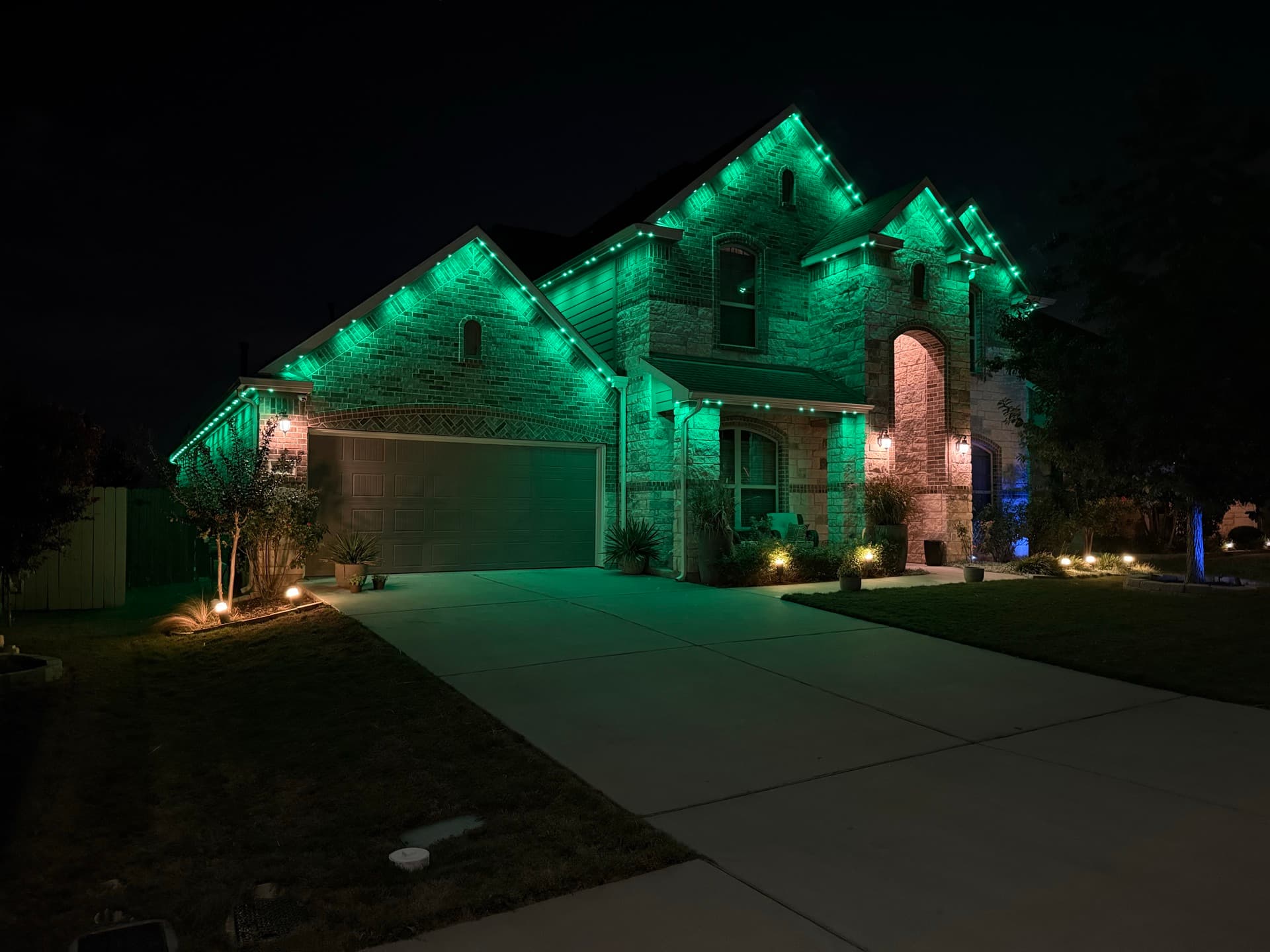 Smart automated permanent lighting with zone control on an Austin home
