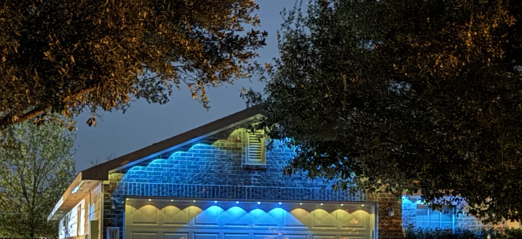 Govee installation with distinct pools of light across a garage fascia
