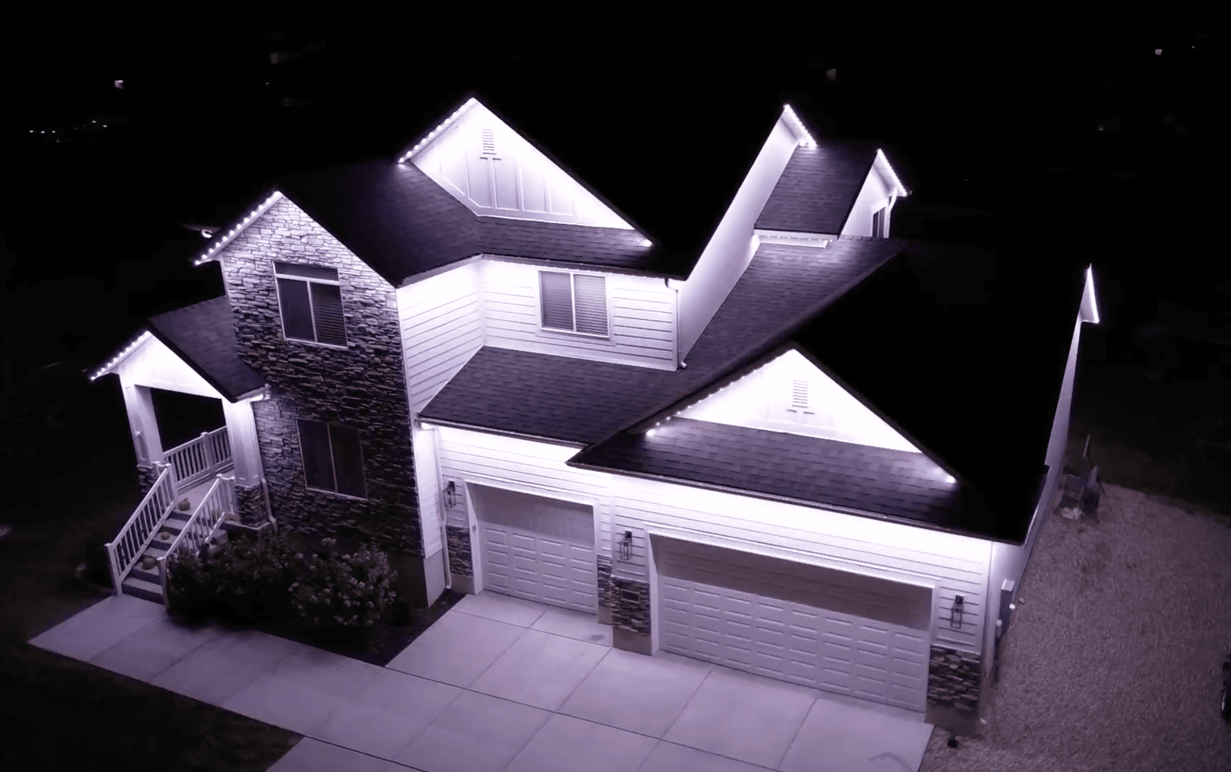 Permanent LED roofline lighting on a Hill Country home in Spring Branch, Texas