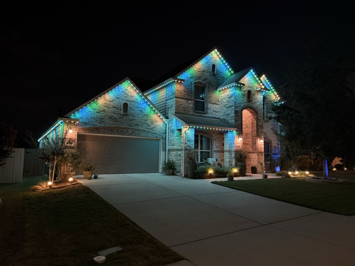 Smart automated permanent lighting with zone control on an Austin home